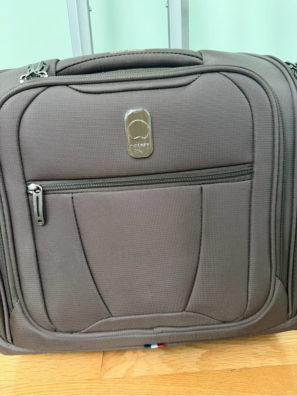 Brown Rolling Carry-On under seat luggage